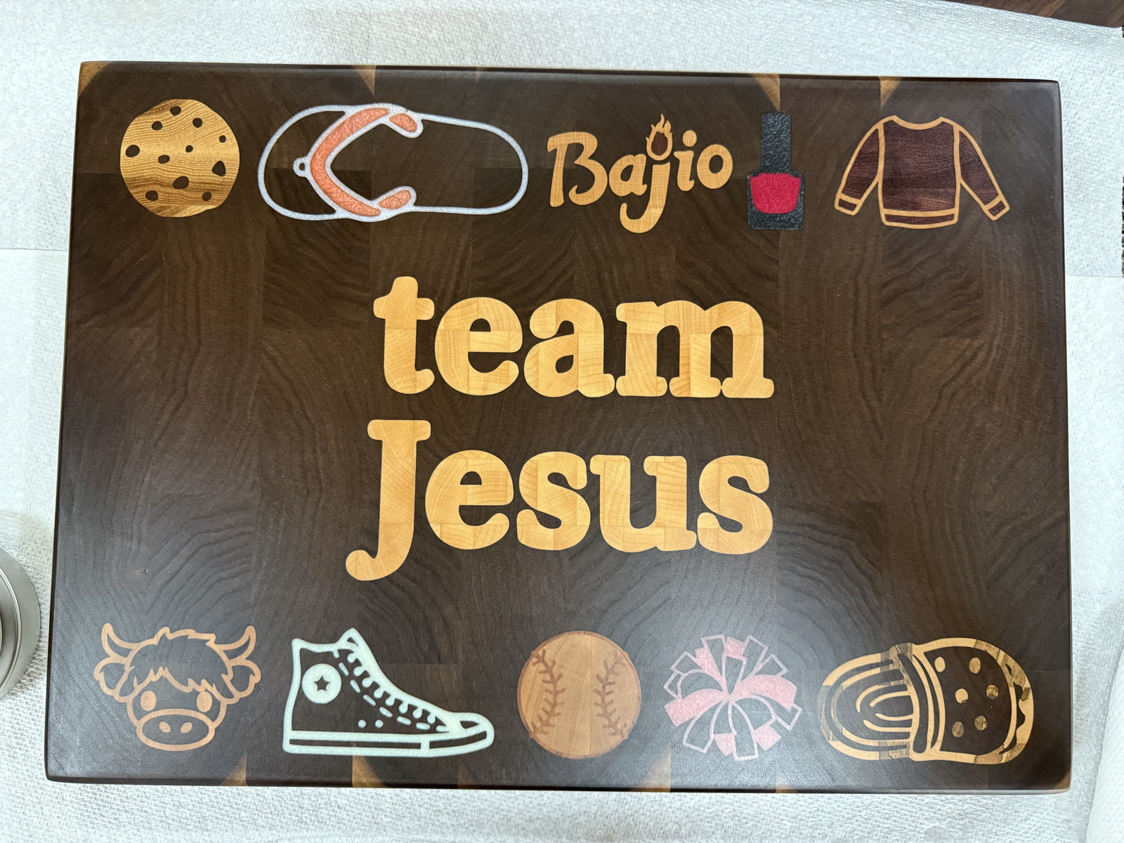 A Team Jesus custom cutting board
